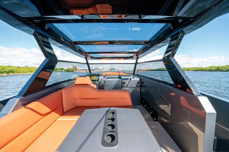 Slide: The Image of Luxurious 2022 Vanquish Yachts VQ45 interior with orange seating and panoramic views. - 16