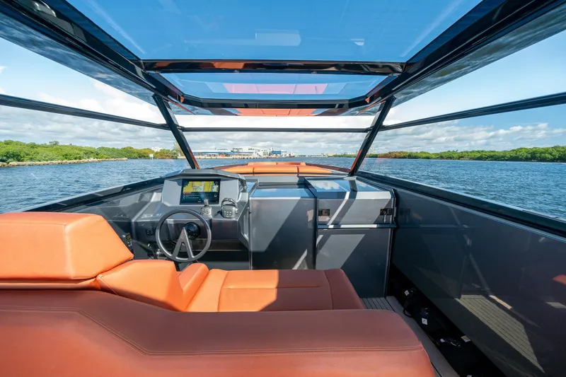 Slide: The Image of 2022 Vanquish Yachts VQ45 interior with modern helm, luxurious seating, and panoramic views. - 18