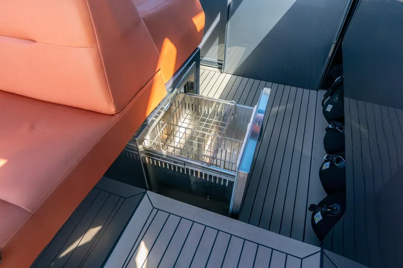 Slide: The Image of Luxury yacht Vanquish VQ45 interior with sleek seating and built-in storage, 2022 model. - 20