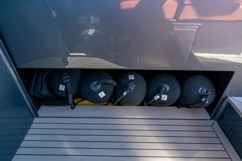 Slide: The Image of Storage compartment on 2022 Vanquish Yachts VQ45 with fenders and accessories. - 21