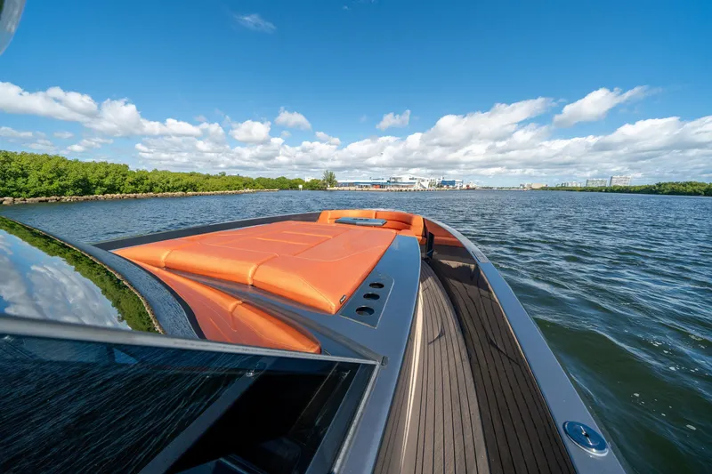 Slide: The Image of Luxurious 2022 Vanquish Yachts VQ45 cruising on a sunny day, featuring sleek design and vibrant seating. - 23