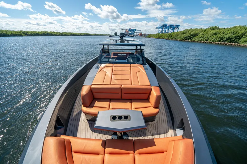 Slide: The Image of 2022 Vanquish Yachts VQ45 luxury yacht with orange seating on a sunny day. - 27