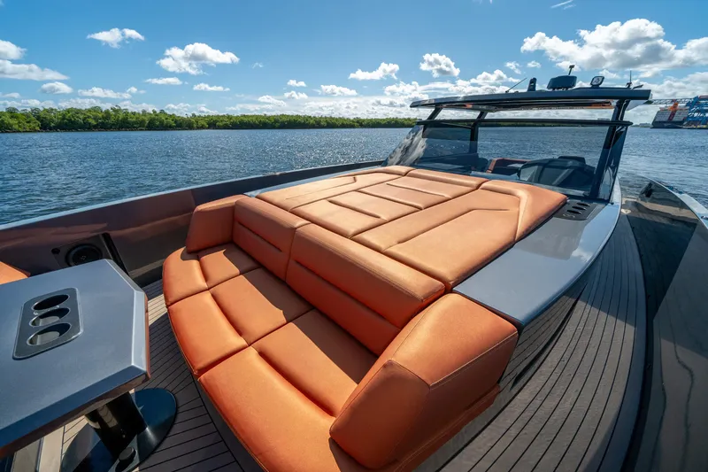 Slide: The Image of Luxurious 2022 Vanquish Yachts VQ45 with spacious sunbed on serene water. - 3