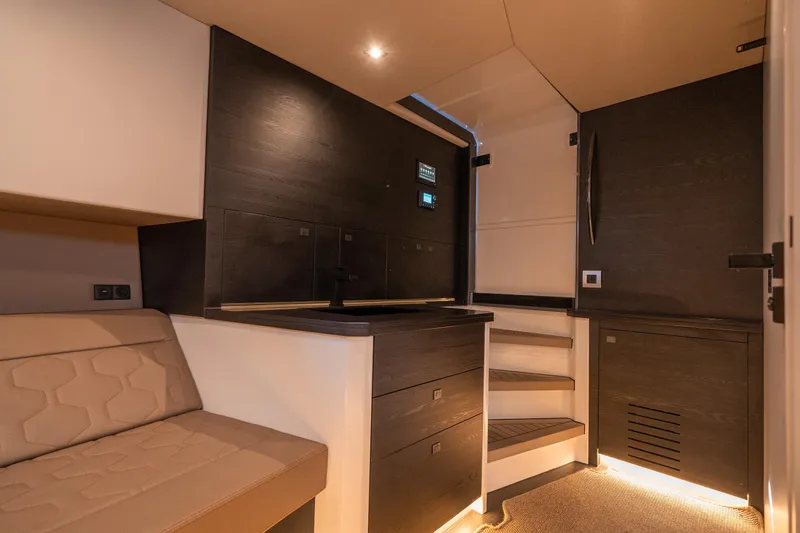 Slide: The Image of Luxurious interior of 2022 Vanquish Yachts VQ45, featuring modern design and ambient lighting. - 32