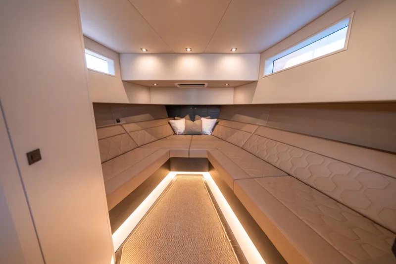 Slide: The Image of Luxurious interior of 2022 Vanquish Yachts VQ45 with elegant seating and ambient lighting. - 34