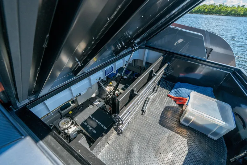Slide: The Image of 2022 Vanquish Yachts VQ45 engine compartment with Volvo Penta engine, open hatch view. - 37