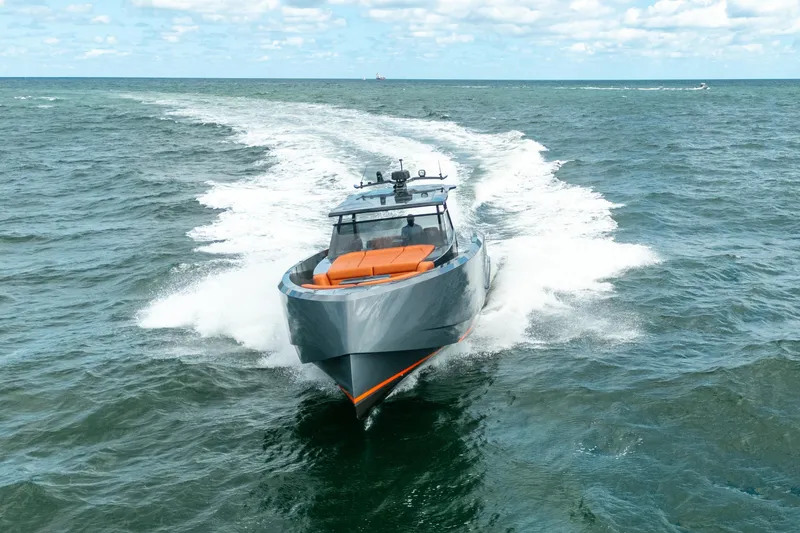 Slide: The Image of 2022 Vanquish Yachts VQ45 cruising on open sea under blue sky. - 39