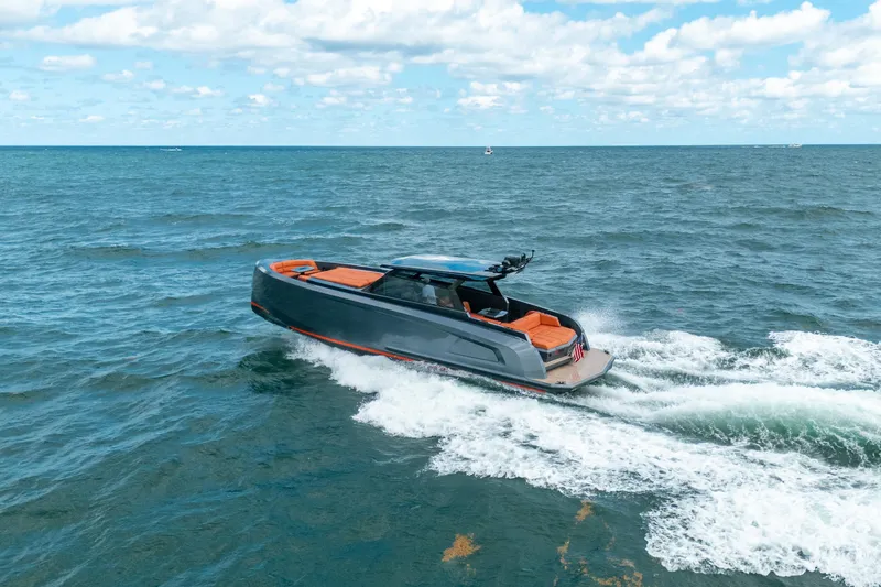 Slide: The Image of 2022 Vanquish Yachts VQ45 cruising on open water under a clear sky. - 40