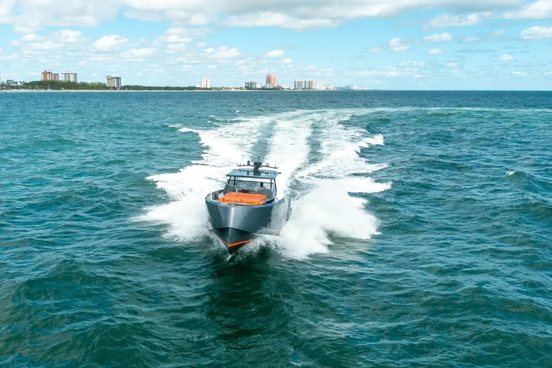 Slide: The Image of Vanquish Yachts VQ45 2022 cruising on open sea under blue sky. - 41