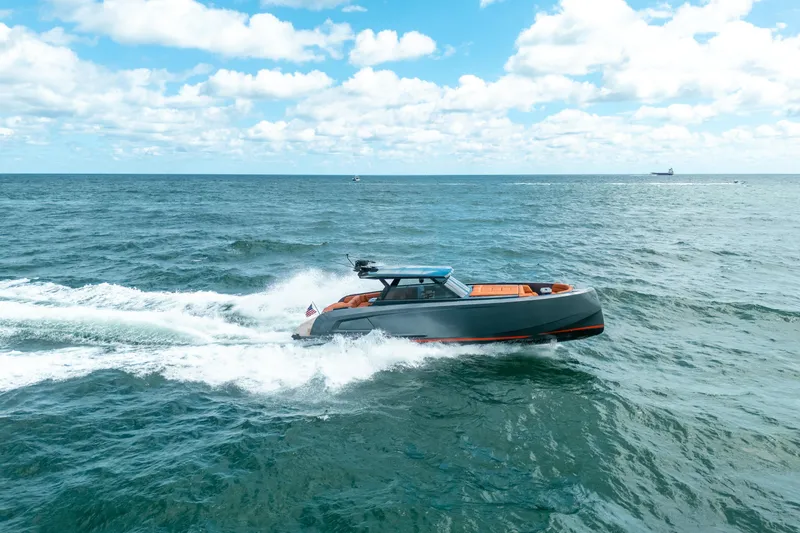 Slide: The Image of 2022 Vanquish Yachts VQ45 cruising on open ocean under clear skies. - 42