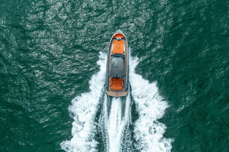 Slide: The Image of 2022 Vanquish Yachts VQ45 cruising on open sea, showcasing sleek design and speed. - 44