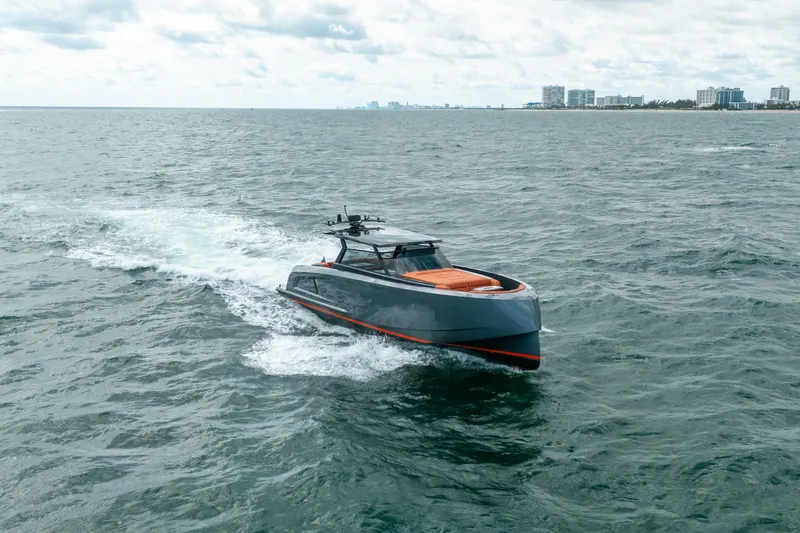 Slide: The Image of Aerial view of 2022 Vanquish Yachts VQ45 cruising on open water. - 45