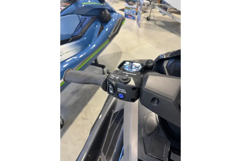 Slide: The Image of 2025 Yamaha WaveRunner FX HO handlebar controls in showroom setting. - 5