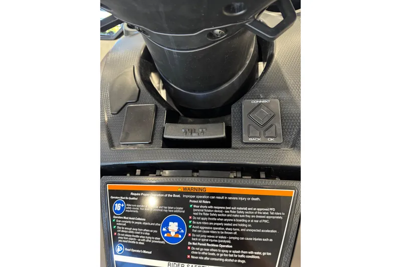 Slide: The Image of 2025 Yamaha WaveRunner FX HO dashboard with controls and warning label. - 7