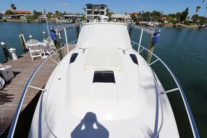 Slide: The Image of 2012 Intrepid 430 Sport Yacht docked at a sunny marina. - 11