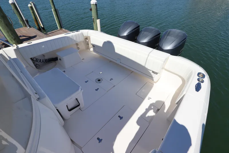Slide: The Image of 2012 Intrepid 430 Sport Yacht deck with triple outboard engines. - 13