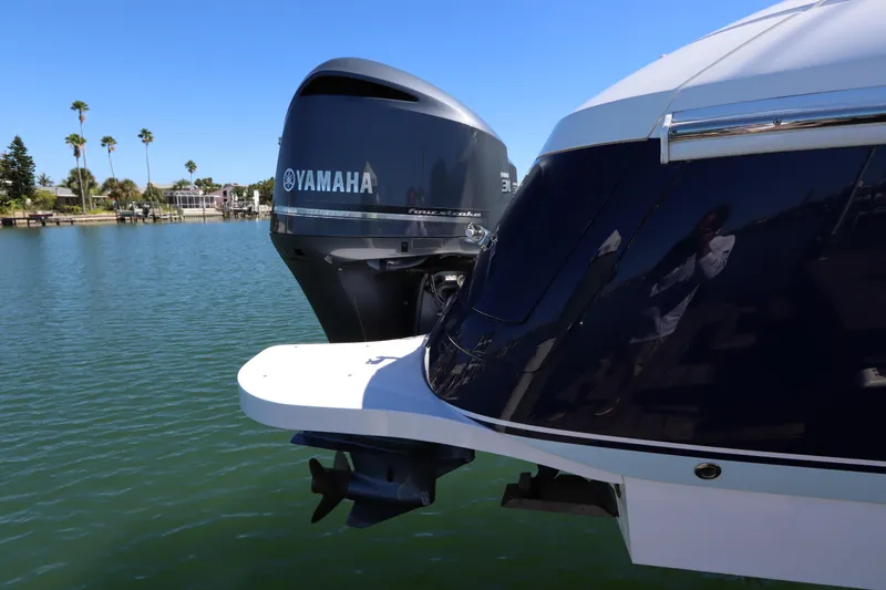 Slide: The Image of 2012 Intrepid 430 Sport Yacht with Yamaha outboard motor on calm water. - 14
