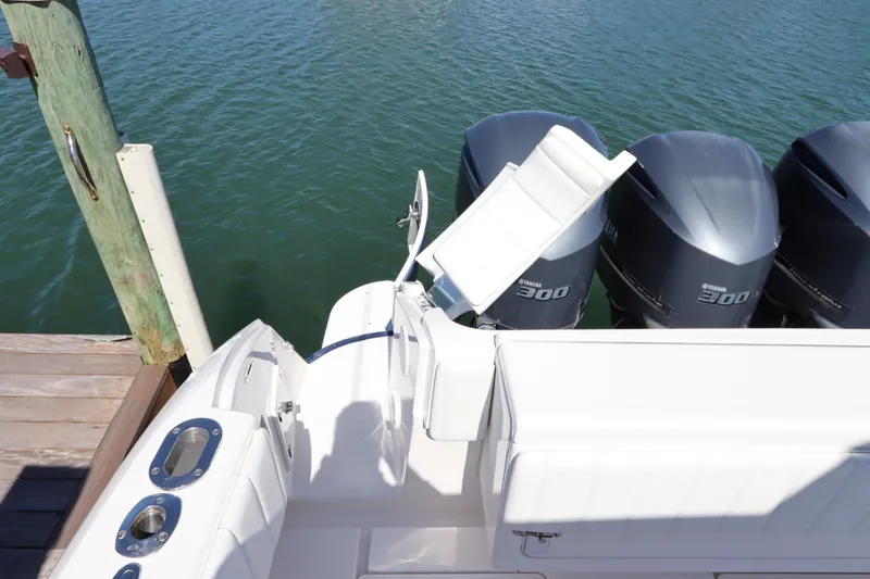 Slide: The Image of 2012 Intrepid 430 Sport Yacht with Yamaha 300 engines docked by the water. - 17