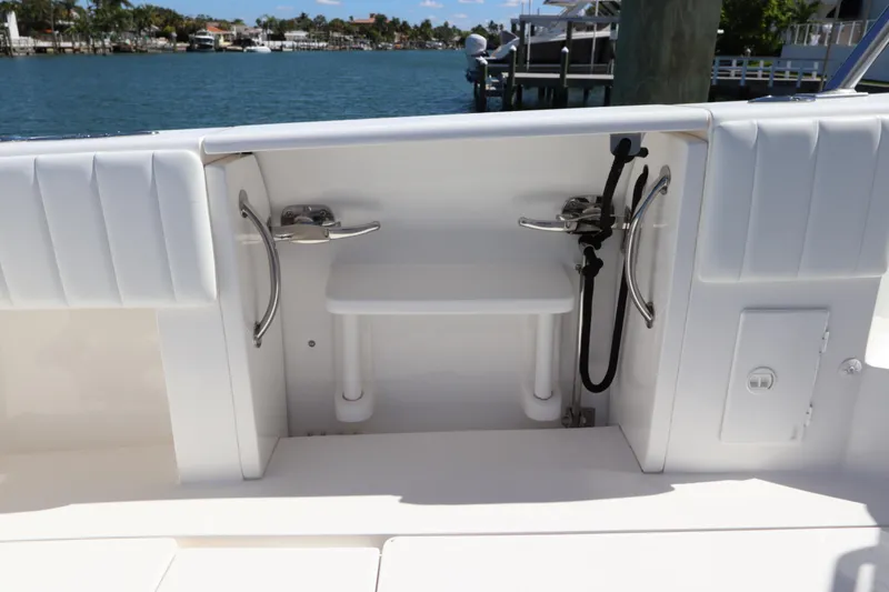 Slide: The Image of 2012 Intrepid 430 Sport Yacht deck with seating and water view. - 20