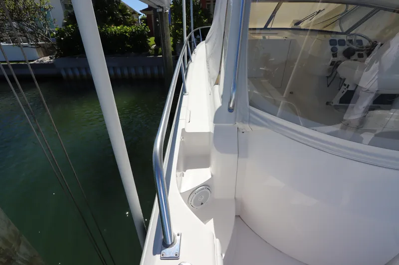 Slide: The Image of 2012 Intrepid 430 Sport Yacht, side deck view with railing and cockpit. - 24