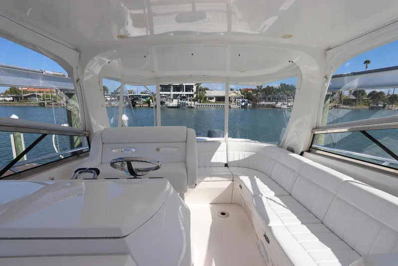 Slide: The Image of Luxurious interior of 2012 Intrepid 430 Sport Yacht with white seating and waterfront view. - 31