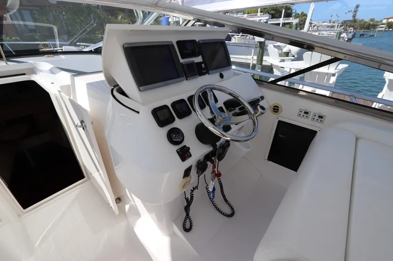 Slide: The Image of Cockpit of 2012 Intrepid 430 Sport Yacht with steering wheel and navigation screens. - 34