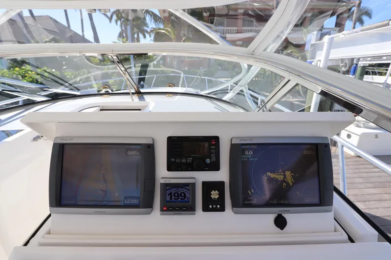 Slide: The Image of Cockpit view of 2012 Intrepid 430 Sport Yacht with navigation displays and controls. - 37