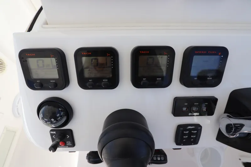 Slide: The Image of Control panel of a 2012 Intrepid 430 Sport Yacht with tachometers and navigation instruments. - 38