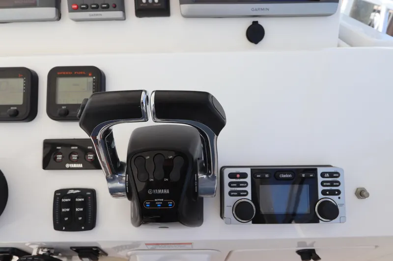 Slide: The Image of Control panel of 2012 Intrepid 430 Sport Yacht with Yamaha throttle and Clarion audio system. - 39