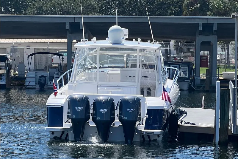 Slide: The Image of 2012 Intrepid 430 Sport Yacht docked with triple 300 horsepower engines. - 4