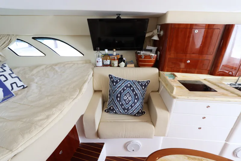 Slide: The Image of Luxurious interior of 2012 Intrepid 430 Sport Yacht with cozy seating and elegant decor. - 47