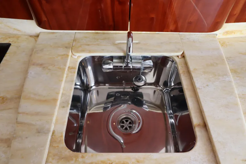 Slide: The Image of Stainless steel sink on 2012 Intrepid 430 Sport Yacht with marble countertop. - 50