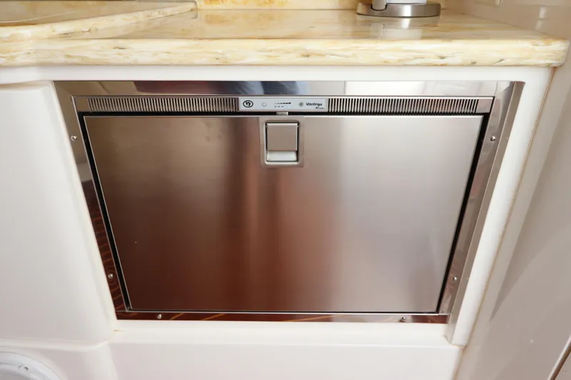 Slide: The Image of Stainless steel refrigerator on 2012 Intrepid 430 Sport Yacht, under marble countertop. - 51