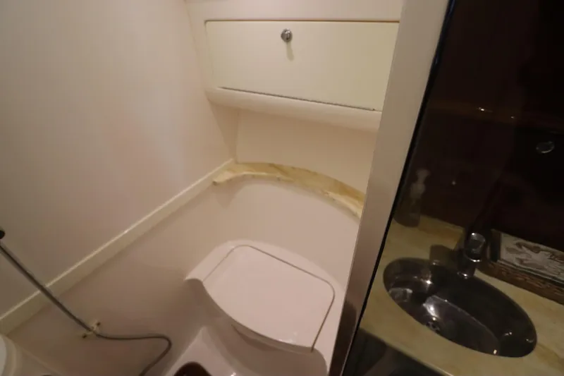 Slide: The Image of Bathroom interior of 2012 Intrepid 430 Sport Yacht with toilet and sink. - 58