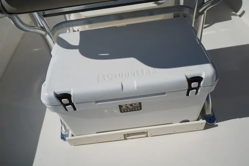 Slide: The Image of White cooler on 2024 Key West 210 Bay Reef boat deck, secured with metal brackets. - 19