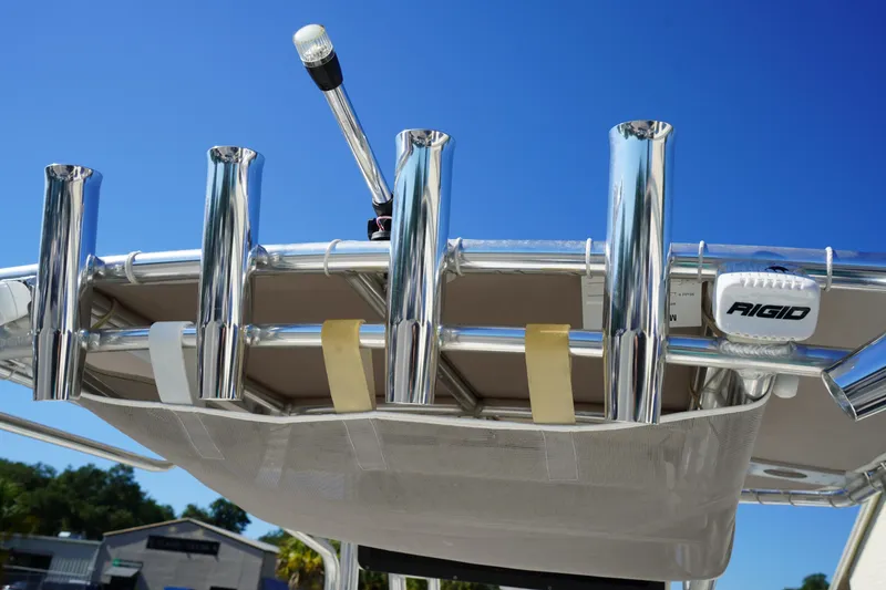 Slide: The Image of 2024 Key West 210 Bay Reef boat with chrome rod holders and Rigid light. - 21