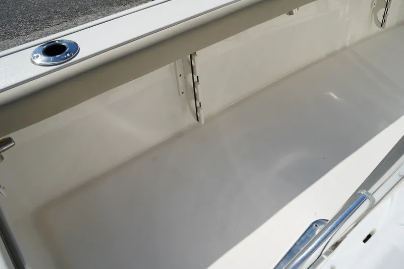 Slide: The Image of 2024 Key West 210 Bay Reef storage compartment, featuring sleek design and ample space. - 22