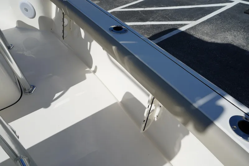 Slide: The Image of 2024 Key West 210 Bay Reef boat interior with sleek design and rod holders. - 23