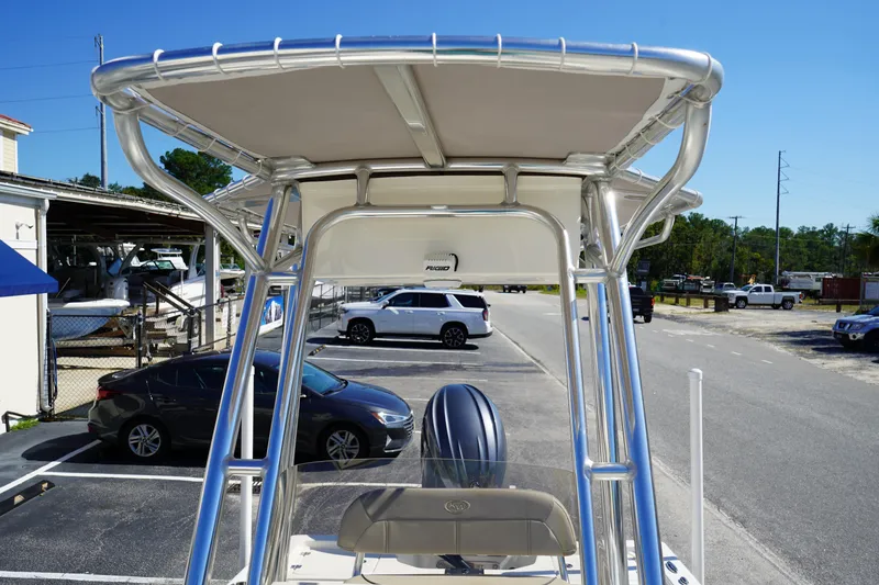 Slide: The Image of 2024 Key West 210 Bay Reef boat with T-top in parking lot. - 31