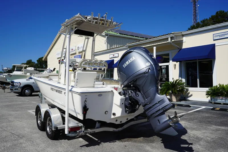 Slide: The Image of 2024 Key West 210 Bay Reef boat with Yamaha outboard motor on trailer. - 5