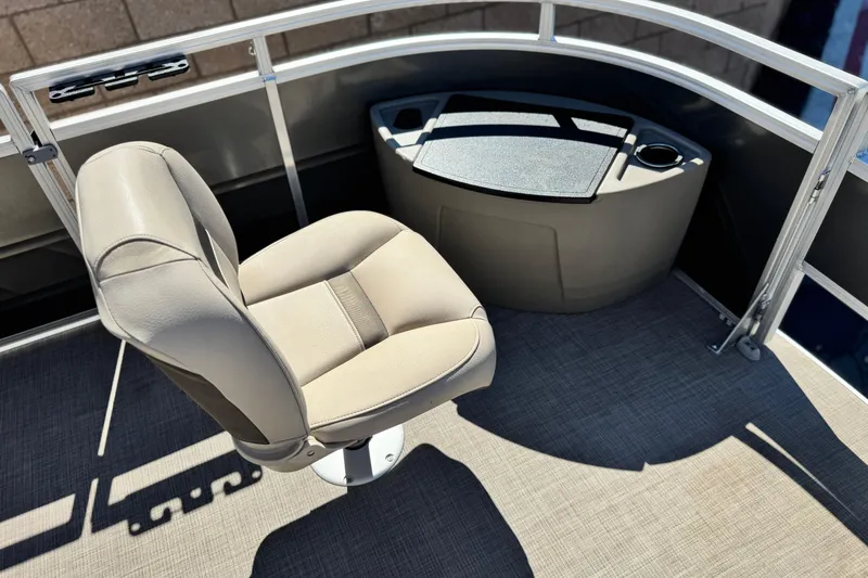 Slide: The Image of 2024 Sun Tracker Fishin' Barge 20 DLX with beige captain's chair and console. - 11