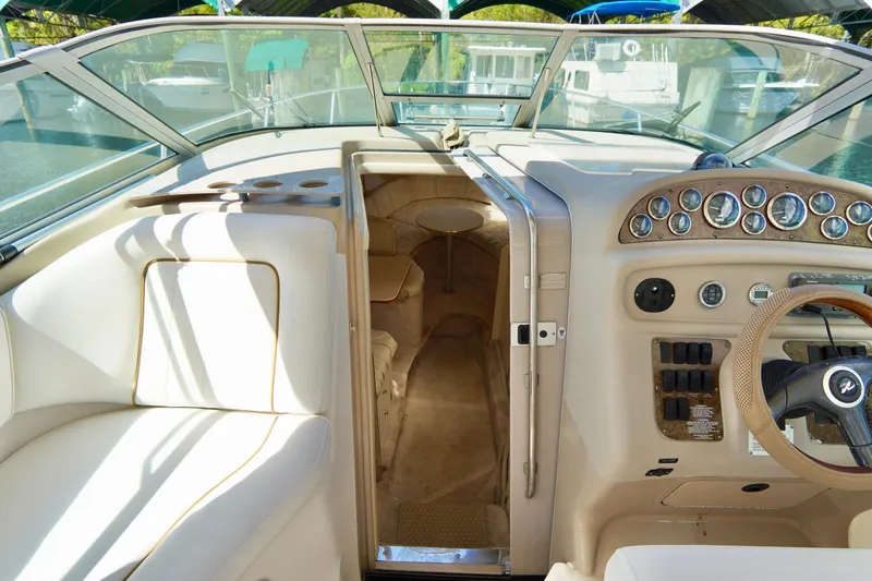 Slide: The Image of Interior view of 2000 Sea Ray 280 Sundancer boat cockpit and cabin entrance. - 11
