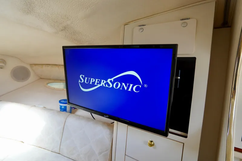 Slide: The Image of Interior of 2000 Sea Ray 280 Sundancer boat with cozy seating and kitchenette. - 17