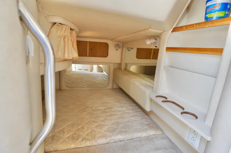 Slide: The Image of 2000 Sea Ray 280 Sundancer bathroom with sink, toilet, and air freshener. - 22