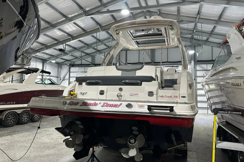 Slide: The Image of 2021 Chaparral 347 SSX boat in storage, rear view, indoor facility. - 12
