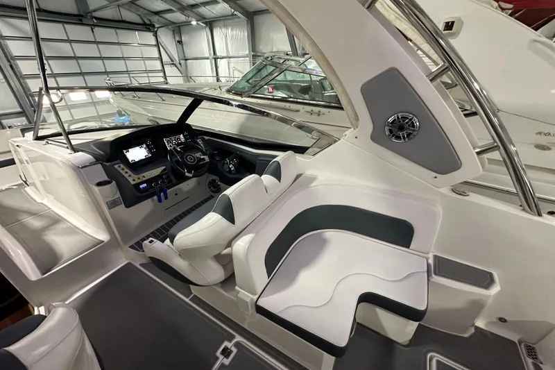 Slide: The Image of 2021 Chaparral 347 SSX boat interior with modern dashboard and seating. - 19