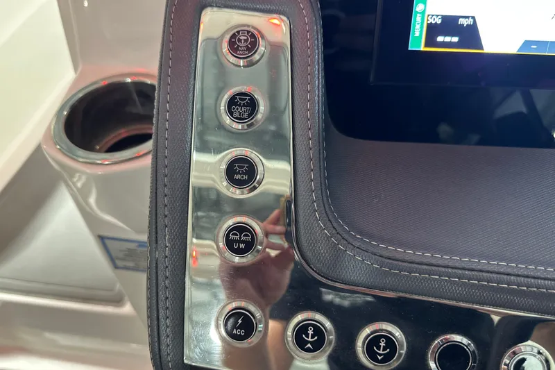 Slide: The Image of Control panel of 2021 Chaparral 347 SSX boat with various function buttons. - 39