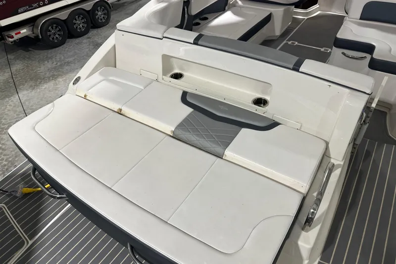 Slide: The Image of 2021 Chaparral 347 SSX boat interior with cushioned seating and sleek design. - 43
