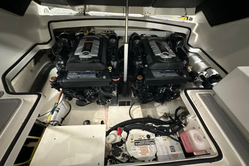 Slide: The Image of Engine compartment of 2021 Chaparral 347 SSX with dual engines and battery setup. - 58
