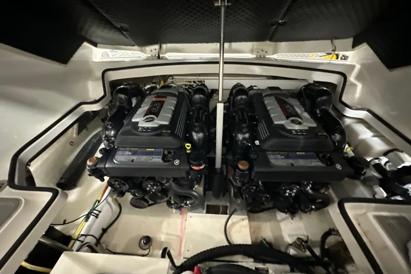 Slide: The Image of Engine compartment of 2021 Chaparral 347 SSX boat, featuring dual powerful engines. - 62